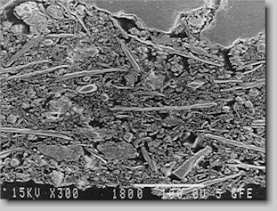 Bild 7. Anschliff eines geschlichteten Coldbox-Formstoffes, 240-fach